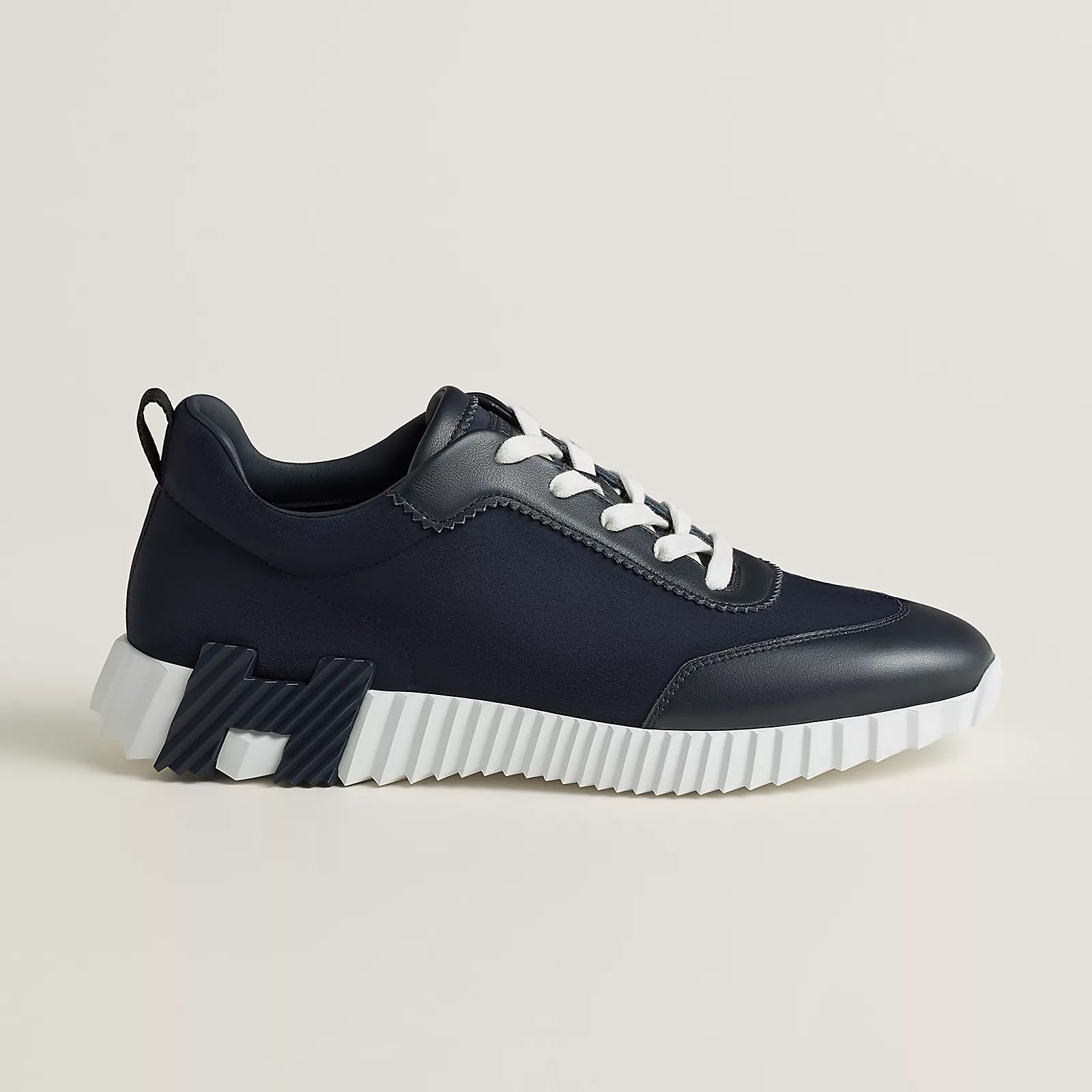 Hermès Bouncing Sneaker in a deep marine blue colorway